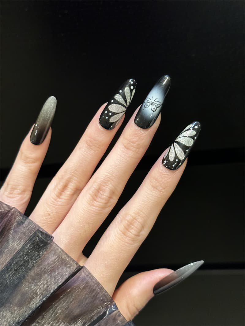 Butterfly Long Oval Black Press On Nails on hand